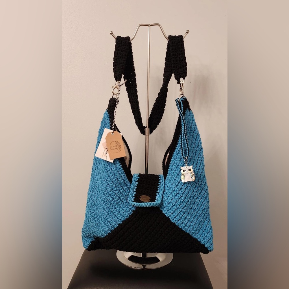 Medium sized blue and black handbag